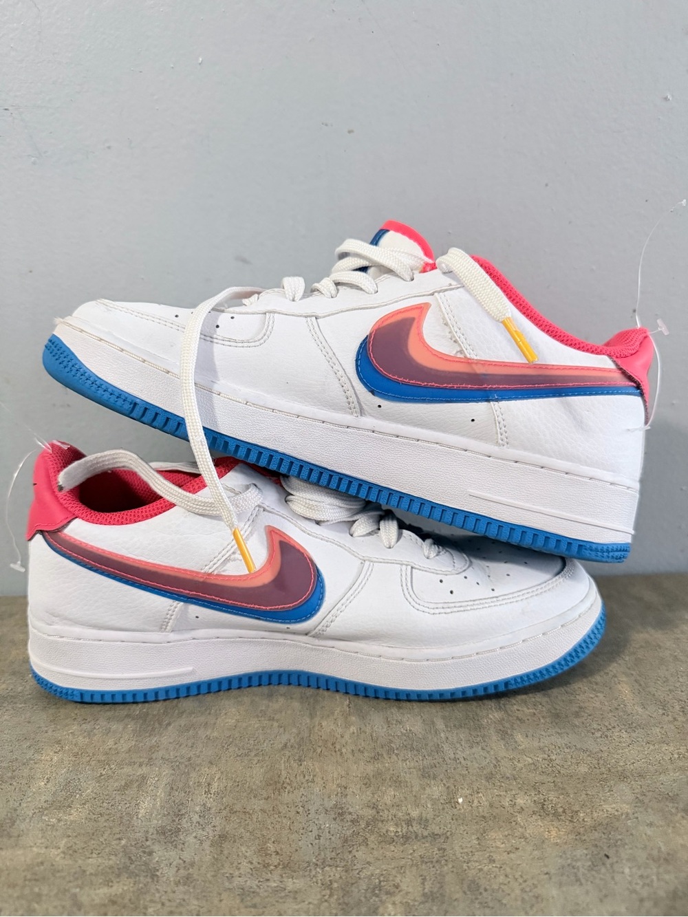 Nike White Low-Top Sneakers with Pink & Blue Swoosh